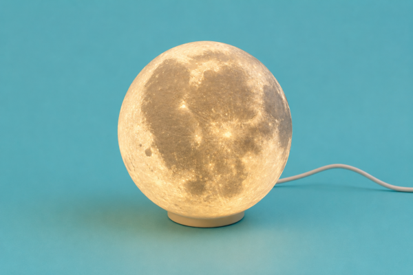 Glowing 3D printed moon lamp on a stand from Vesta Scotland